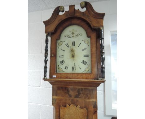 An early 19th century mahogany longcase clock having swan neck and pillar hood, containing painted dial and 30 hour movement,