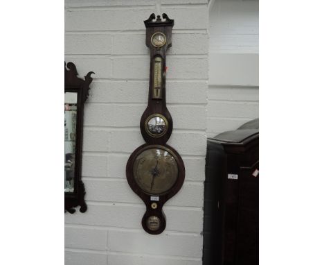A 19th century rosewood case wheel barometer having crest, with humidity, thermometer level scales