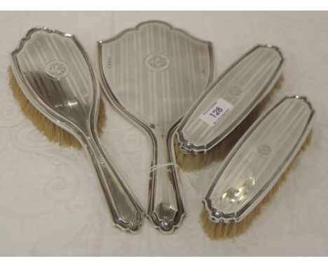 A four piece silver dressing table set having engine turned stripe decoration and monogram D G to cartouches, Birmingham 1914