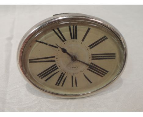 A French silver desk clock of plain oval form having 8 day movement and easel stand (AF)