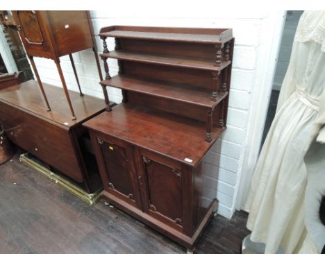 A 19th century mahogany chiffonier having three tier pillar raised back over double cupboard and plinth base 