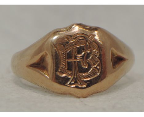 A gents 9ct rose gold signet ring bearing monogram, size W.&nbsp; APPROX 6.9G