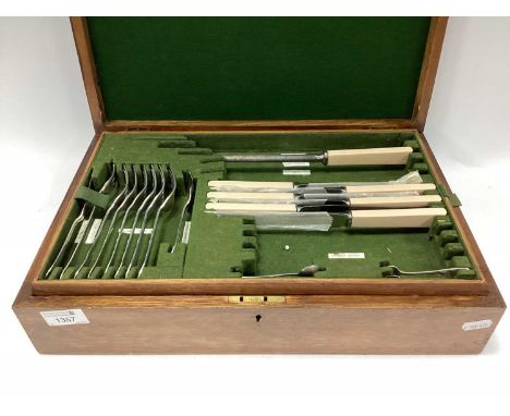 An Edwardian Wooden Cased 52 Piece (part) Cutlery Set, mostly marked Potter Sheffield (bottom section complete).