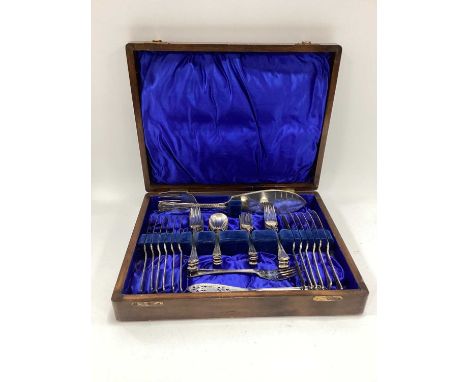 An Edwardian wooden-cased 40-piece cutlery set including fish servers marked Mappin Bros.