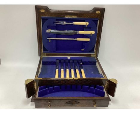 Viners of Sheffield Oak Cutlery Box, holding nine pieces, barley twist supports and blind fretwork to front, blank name plate