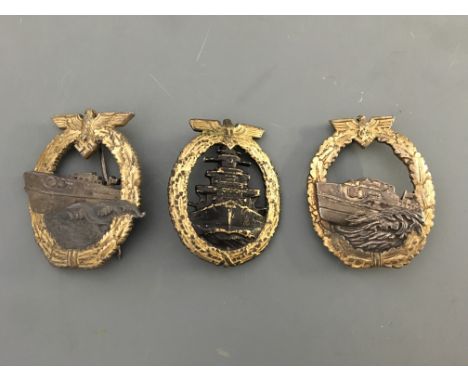 A German navy High Seas fleet badge, with two Kriegsmarine E Boat badges first and second pattern types.