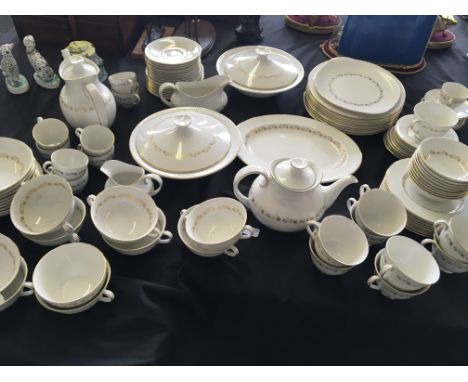 A Royal Doulton Fairfax dinner service to include casserole dishes, dinner plates, dessert bowls, tea pots, cups and saucers,