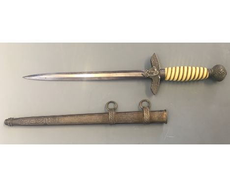 A Luftwaffe Nazi German dagger with metal scabbard.