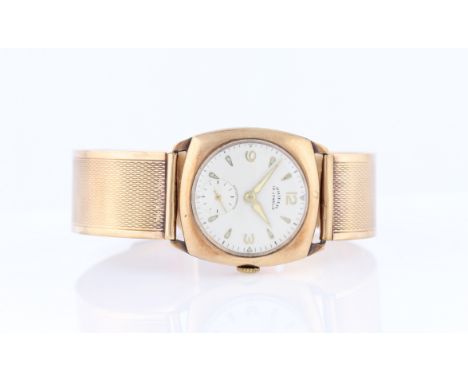 A 9ct yellow gold cased Shield wrist watch, the dial having quarterly Arabic numerals and hourly tear drop shaped markers, wi