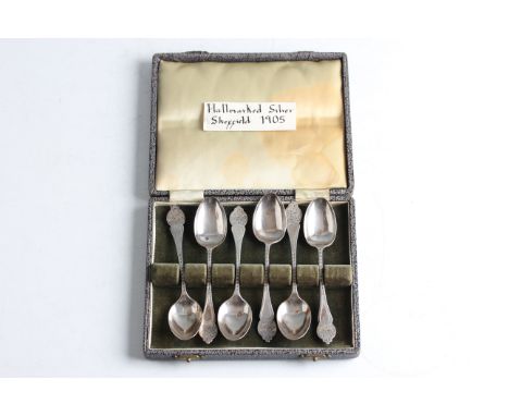 A boxed set of six early 20th Century silver teaspoons, each with engraved handle and finial, hallmarked Sheffield 1905, with
