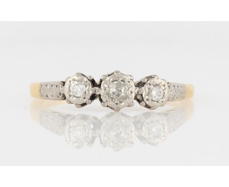 A three stone diamond ring, set with three graduated diamonds, the central being an old mine cut flanked to either side with 