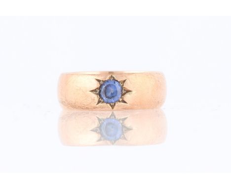 A sapphire ring, star set with a round cut sapphire measuring approx. 4mm, rose metal stamped 9ct, ring size M.