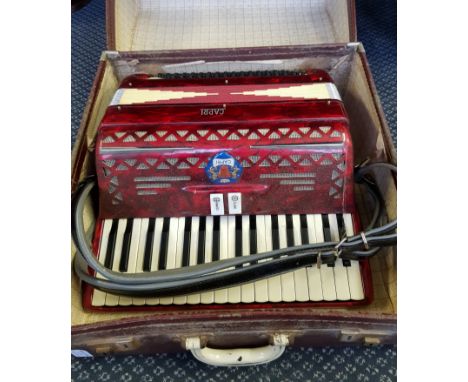A Capri red marbled finish accordion in case.