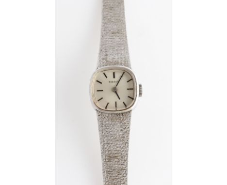 A ladies 9ct white gold cased Tissot wrist watch, the dial having hourly baton markers, inner case hallmarked London 1974, on