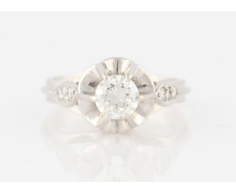 A 14ct white gold diamond ring, centrally claw set with a round brilliant cut diamond measuring approx. 0.75ct, in raised set