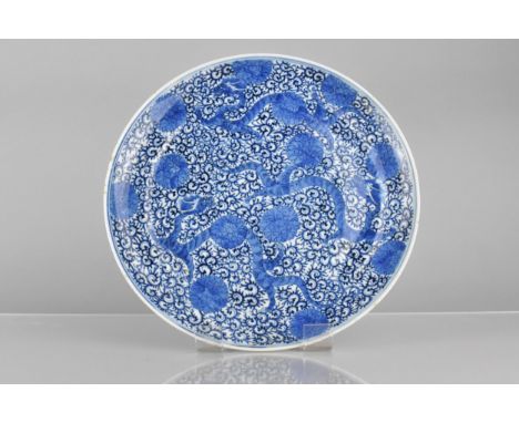 A Chinese Qing Dynasty Porcelain Blue and White Plate Decorated with Three Dragons Amongst Scrolled Foliage Four Character Ma