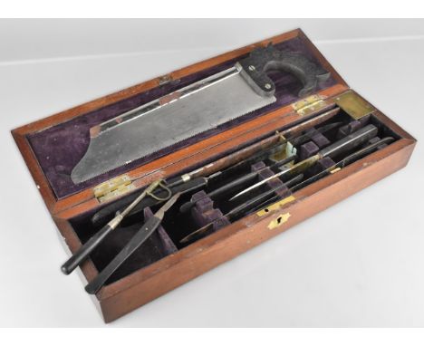 A 19th Century Mahogany Cased Surgeon's Field Amputation Box The Fitted Interior Containing Various Tools, Mainly Flesh Knive