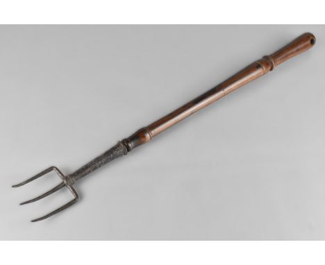 An 18th Century George III Toasting Fork With a Long Turned Laburnum Handle, 53cm Long 