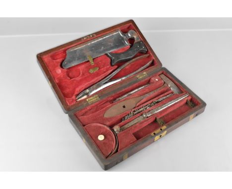 A 19th Century Mahogany Brass Mounted Surgeon's Field Amputation Kit by Coxeter. The Fitted Interior Containing Various Tools