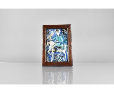 A Framed Persian Qajar Dynasty (18th/19th Century) Polychrome Glazed Pottery Tile Depicting Mounted Hunter and Hawk, Frame 21