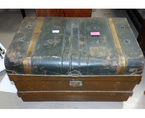 A tin trunk containing a naval jacket and hat (a.f.); a camouflage jacket and rucksack; a brown suitcase
