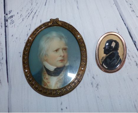 An early 19th century miniature portrait on paper, yellow metal brooch mount (untested), 3.5 x 2.5 cm overall; a miniature po