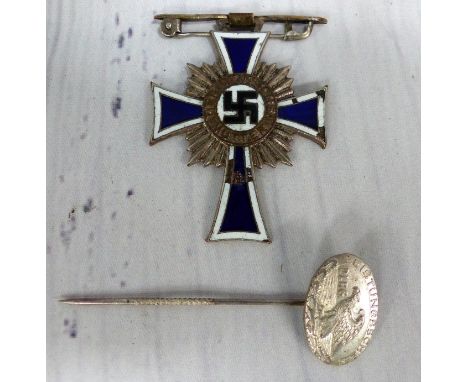 An enamel Motherland badge and a Leistungsschein DLRG pin