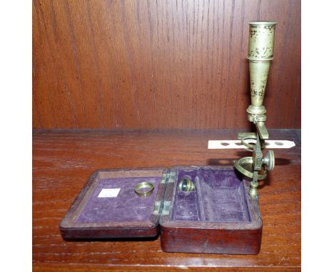 A 19th century brass microscope in mahogany box