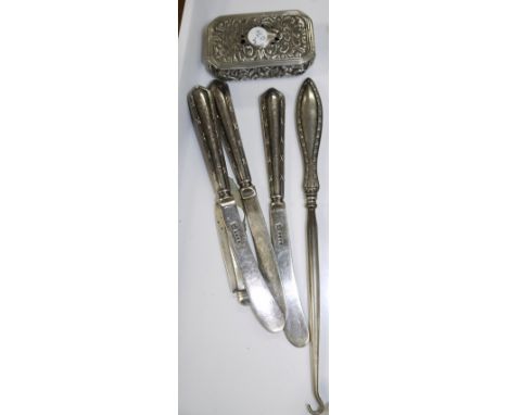 A silver cushion shaped box Birmingham 1920's (a.f.), a silver bladed fruit knife, a button hook and 3 knives