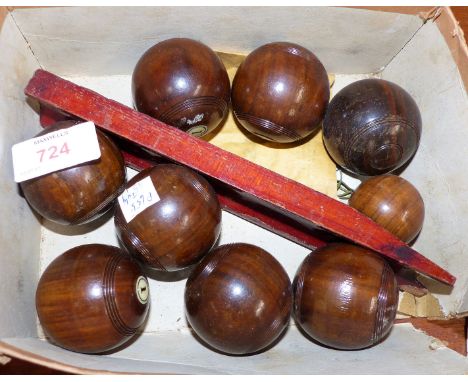 A set of wooden carpet bowls