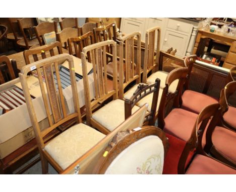 Four Edwardian light oak dining chairs with newly upholstered lift-out seats 