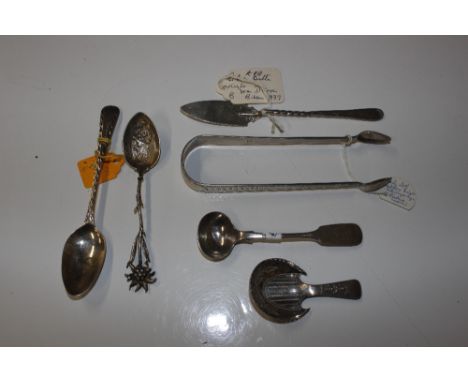 A Georgian silver caddy spoon; a pair of silver sugar nips; a butter knife etc.