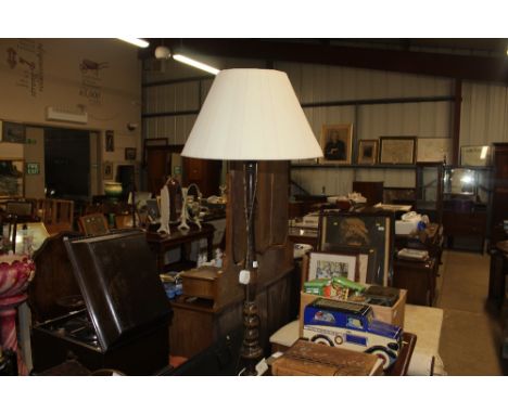 A turned column standard lamp and shade 
