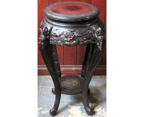 Heavily carved oriental hardwood two tier plant stand. Approx. 76cms H x 41cms D

reasonable used condition 