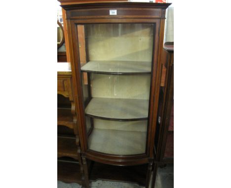 Edwardian mahogany inlaid, bow fronted, single door glazed display cabinet with under shelf, standing on ring turned supports