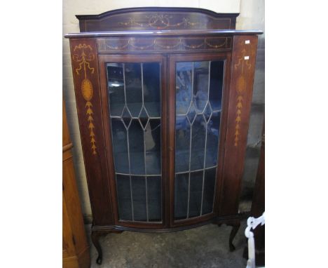 Edwardian mahogany inlaid, bow fronted, two door astragal lead glazed display cabinet, on cabriole legs.(B.P. 24% incl. VAT)