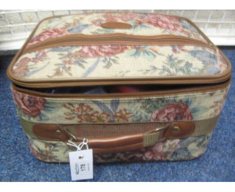 Small tapestry design suitcase containing assorted costume jewellery to include: pearls; beads; bar brooches; mesh type purse