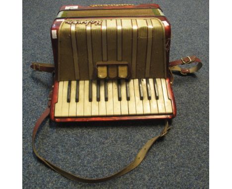 Hohner piano accordion with red rouge marbled finish.(B.P. 24% incl. VAT)   CONDITION REPORT:  Extremely dirty, worn and scuf