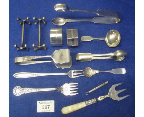 Bag of assorted EPNS and silver to include: sugar nips; knife rests; forks; napkin rings; caddy spoon; propelling miniature p