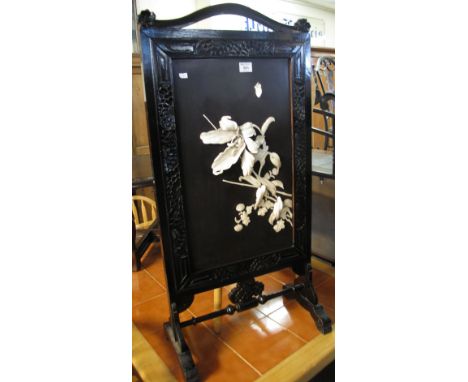 Japanese lacquered and carved fire screen with relief foliate decoration (probably bone).(B.P. 24% incl. VAT)   CONDITION REP