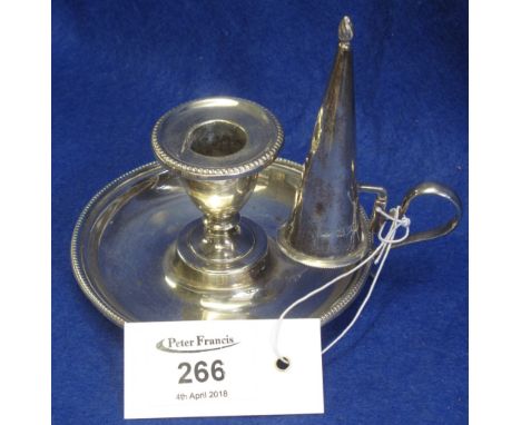 Silver circular chamber stick with conical snuffer, London hallmarks.(B.P. 24% incl. VAT)