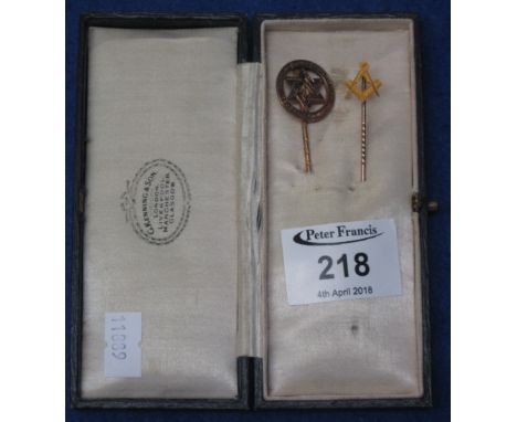 Two Masonic pins, one with pin set square and compass, the other engraved with Latin text, one stamped: 15ct, in associated b
