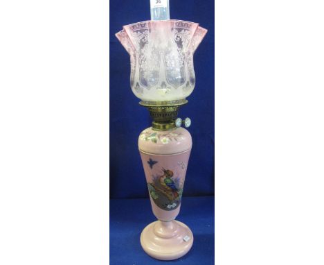 Late Victorian brass double burner oil lamp with pink glass reservoir and vase shaped pedestal base, having painted decoratio