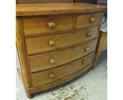 Victorian satin walnut bow fronted chest of two short and three long drawers on baluster turned legs.(B.P. 24% incl. VAT)
