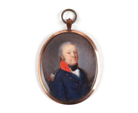 A late 18th / early 19th century yellow metal mounted oval portrait miniature on ivory depicting a military gentleman with me