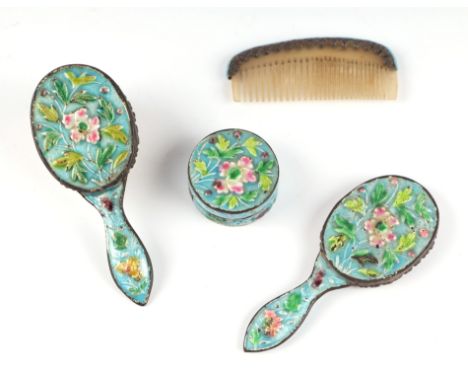 A Chinese enamelled doll's dressing table set comprising of mirror, brush, comb and box, the largest piece 8cms long (4).