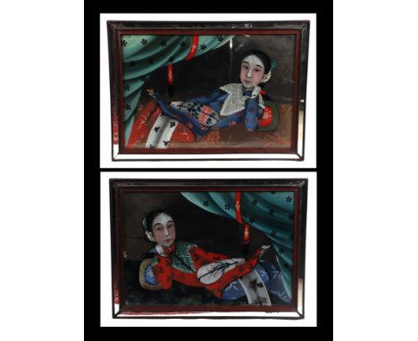 A pair of Chinese Qing dynasty reverse glass mirror paintings depicting reclining ladies holding fans, in their original mirr