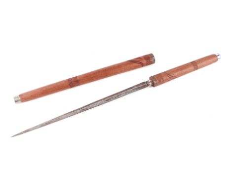 An early 20th century Asian swagger sword stick. With a double edged tapering blade 28.5cms (11.25ins) long and having an ove