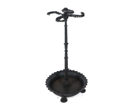 A Victorian cast iron four-division stick stand on lion paw feet, 80cms high.