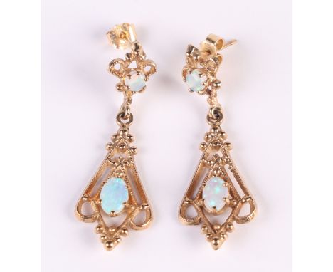 A pair of 9ct gold opal set earrings.Condition ReportThe total weight is 3.6 grams. Possibly early 20th Century.